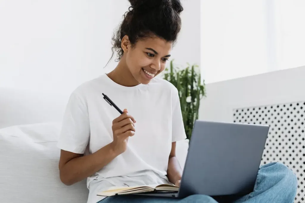 woman on laptop looking for affordable therapy